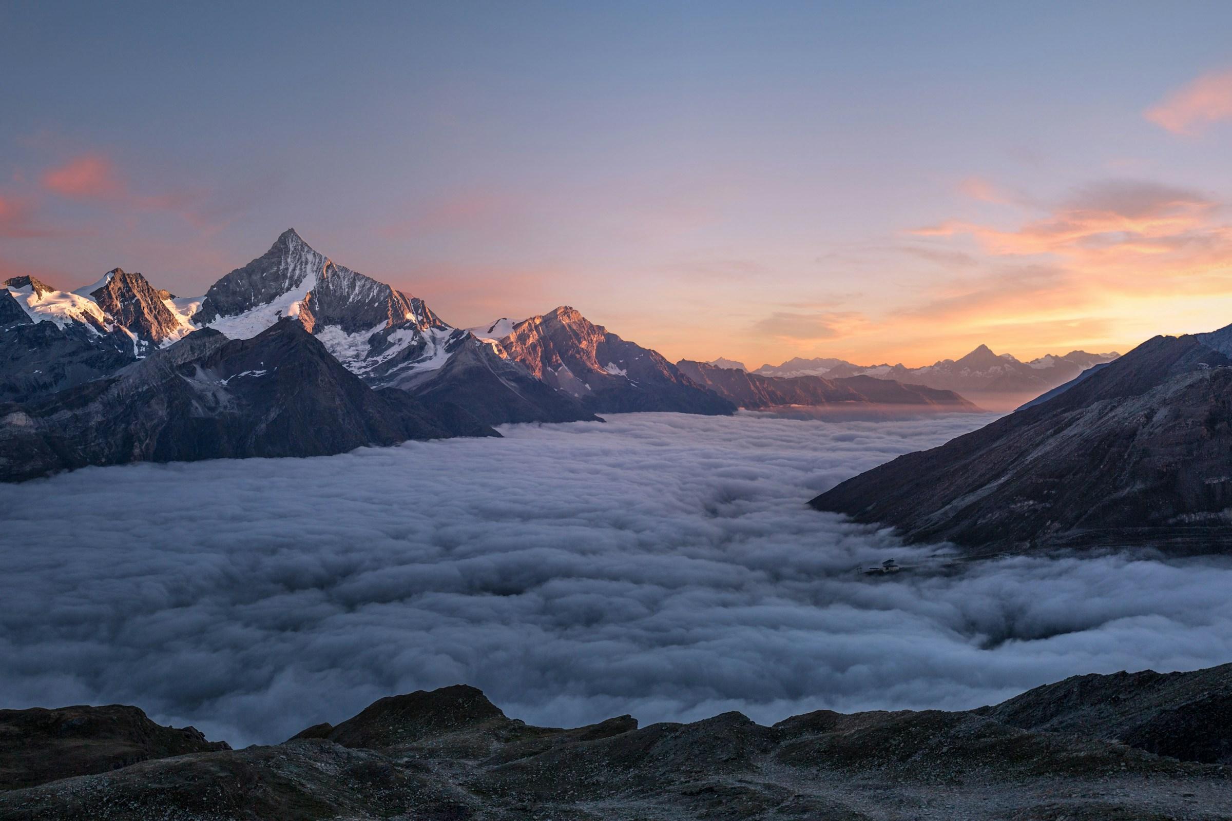 Cinematic mountain landscape demonstrating Leumos AI color grading across multiple looks.